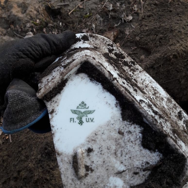 Relic of World War II excavated with a metal detector.